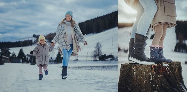 Mutter und Kind in Schneelandschaft mit warmer Kleidung und rutschfesten Schuhen.